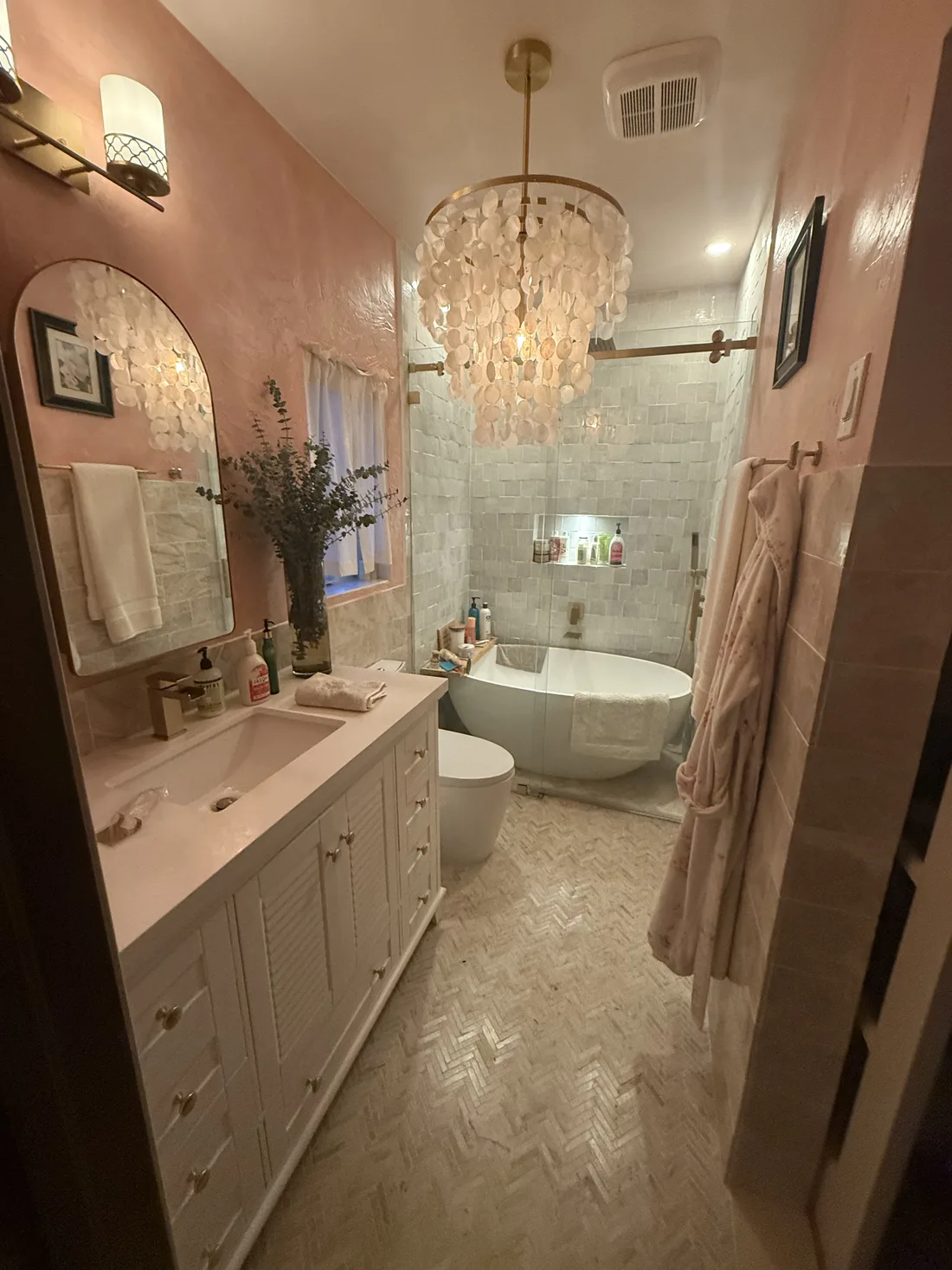 Finished bathroom remodel with chandelier